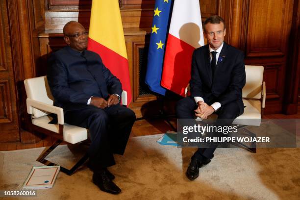 French President Emmanuel Macron and his Malian counterpart Ibrahim Boubacar Keita pose before a meeting in Reims on November 6, 2018 as part of the...