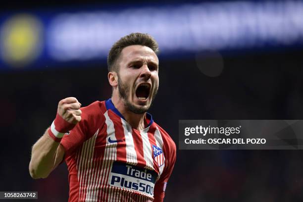 Atletico Madrid's Spanish midfielder Saul Niguez celebrates a goal during the UEFA Champions League group A football match between Club Atletico de...