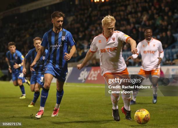 Blackpool's Mark Cullen and Gillingham's Luke O'Neill during the Sky Bet League One match between Gillingham and Blackpool at Priestfield Stadium on...