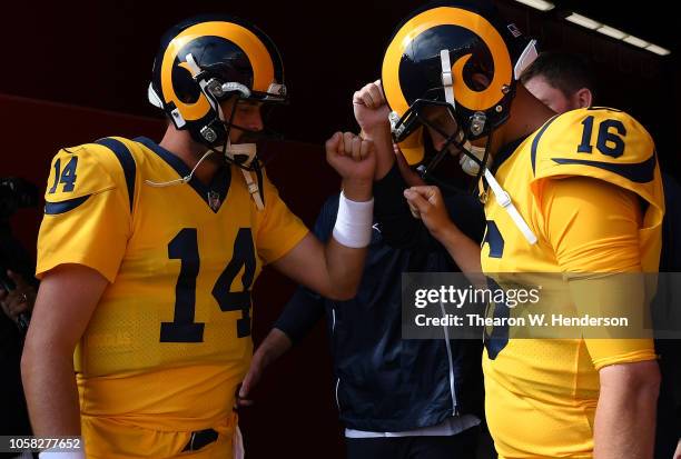 Jared Goff and Sean Mannion of the Los Angeles Rams prepare to walk out onto the field for pregame warm ups prior to the start of an NFL football...