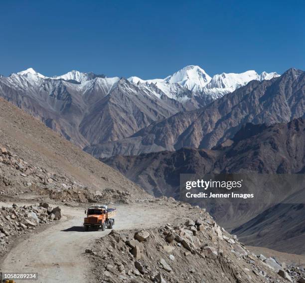 a truck on the road to nubra valley, ladakh in himalayan india. - ladakh stock-fotos und bilder