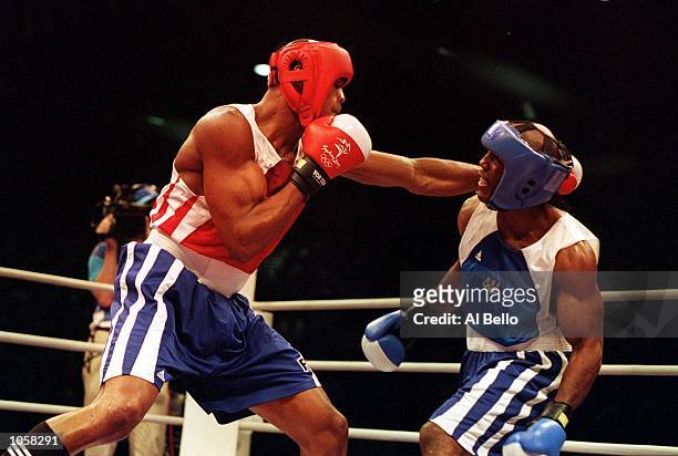 Felix Savon of Cuba in action during his victory over Michael Bennett of the USA in the 91 kilogram boxing bout held at the Sydney Convention and...