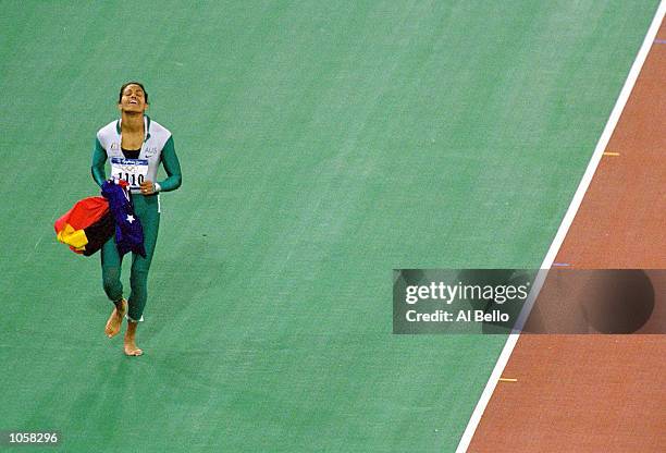 Cathy Freeman of Australia celebrates winning gold in the Womens 400m Final at Olympic Stadium on Day Ten of the Sydney 2000 Olympic Games in Sydney,...