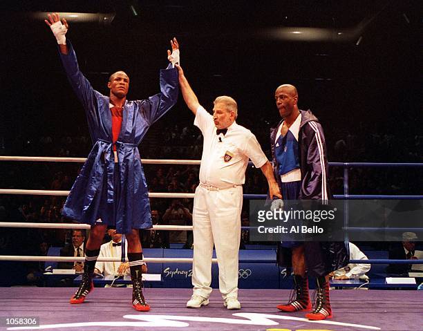 Felix Savon of Cuba celebrates his victory over Michael Bennett of the USA in the 91 kilogram boxing bout held at the Sydney Convention and...