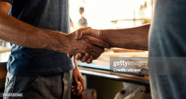 job well done - handshake closeup stock pictures, royalty-free photos & images