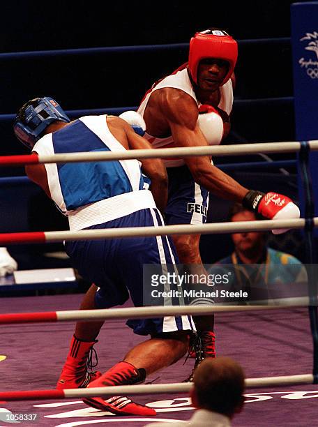 Felix Savon of Cuba throws a right hand during his victory over Michael Bennett of the USA in the 91 kilogram boxing bout held at the Sydney...