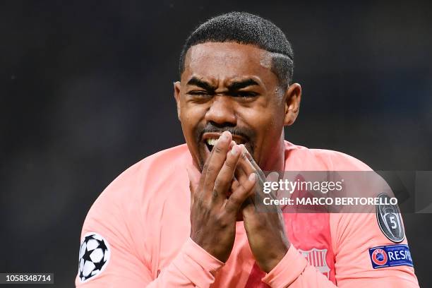 Barcelona's Brazilian midfielder Malcom reacts after opening the scoring during the UEFA Champions League group B football match Inter Milan vs...