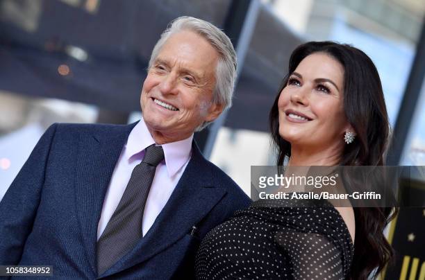 Michael Douglas and Catherine Zeta-Jones attend the ceremony honoring Michael Douglas with star on the Hollywood Walk of Fame on November 06, 2018 in...