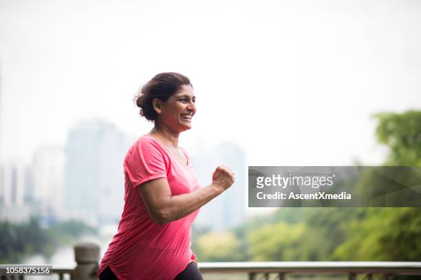 active senior woman enjoying a healthy lifestyle - active lifestyle stock pictures, royalty-free photos & images