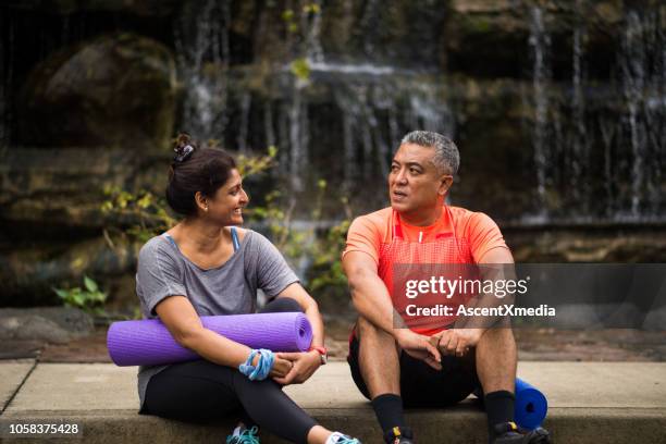 active senior couple enjoying a healthy lifestyle - couple exercising stock pictures, royalty-free photos & images