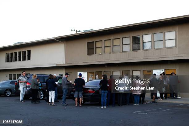 Voters wait in line outside a polling place for California's 10th Congressional District at Modesto Covenant Church on November 6, 2018 in Modesto,...