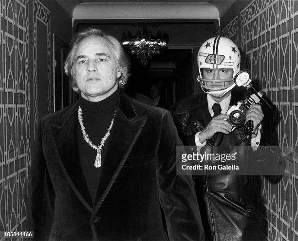 Marlon Brando and photographer Ron Galella during 1st Gala Benefiting the American Indian Development Association at Starlight Room at the Waldorf...