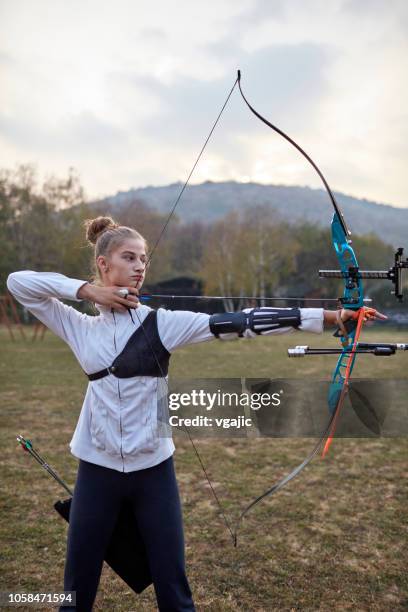 archery training - bow and arrow stock pictures, royalty-free photos & images