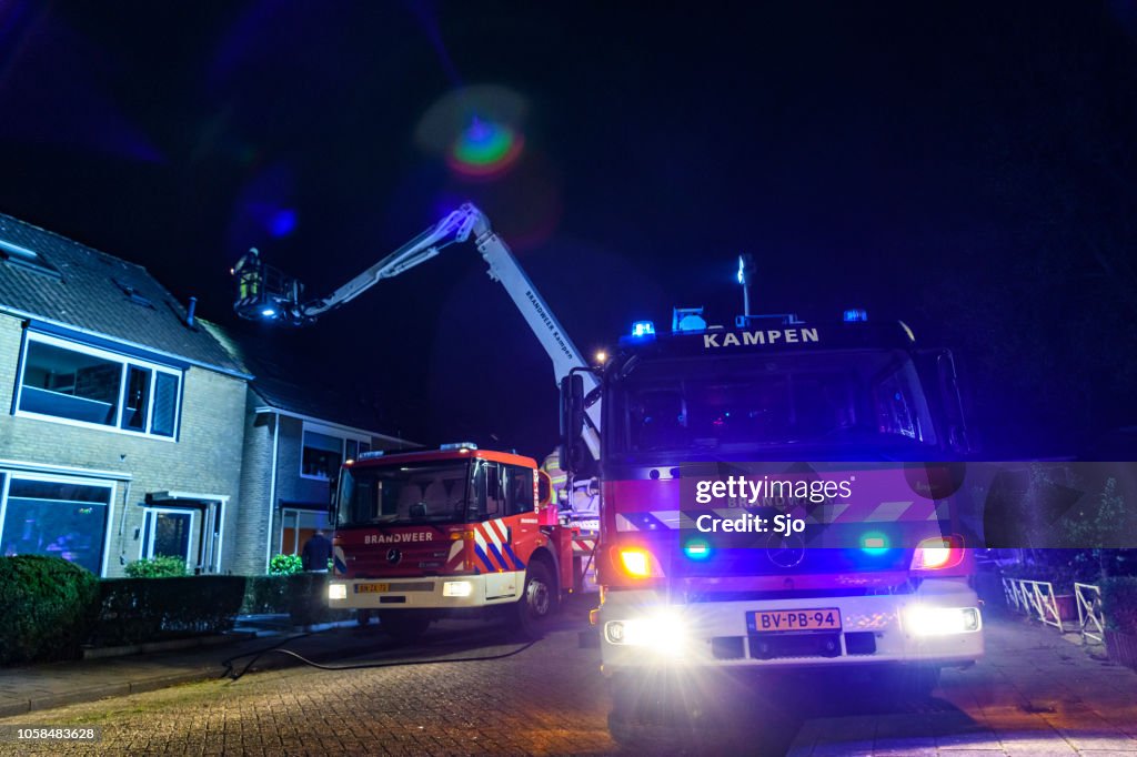 Fire Engines Of The Dutch Fire Brigade At A Chimney Fire In A ...