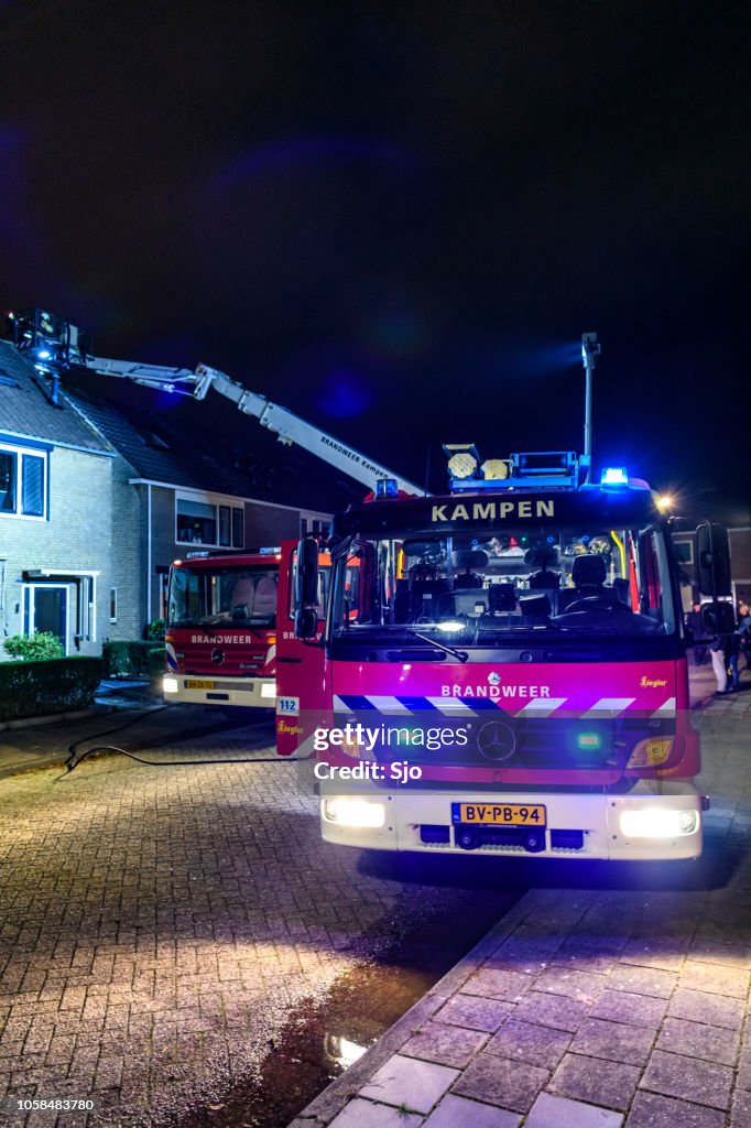 Fire Engines Of The Dutch Fire Brigade At A Chimney Fire In A ...