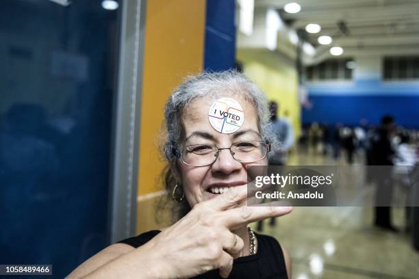 Woman poses after she voted during the midterm election at the High School Art and Design polling station in Manhattan, New York, United States on...