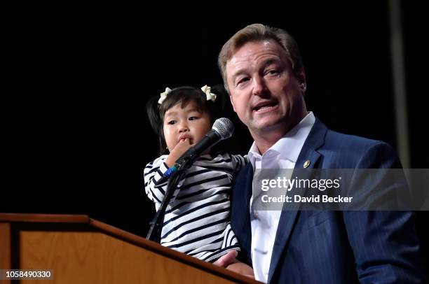 Sen. Dean Heller holds his granddaughter Ava as he speaks at the Nevada Republican Party's election results watch party at the South Point Hotel &...