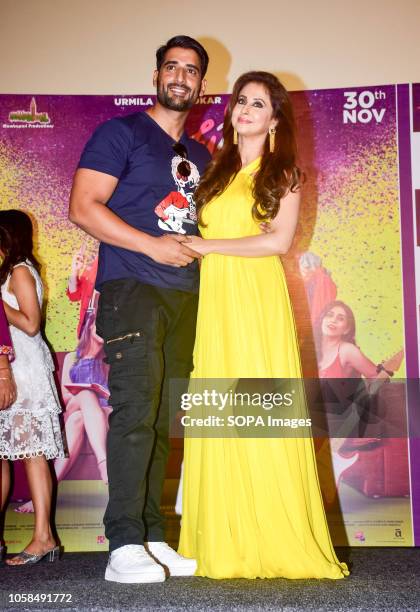 Actress Urmila Matondkar with her husband Mohsin Akhtar seen posing at the trailer launch of marathi film 'Madhuri' at Cinepolis Andheri in Mumbai.