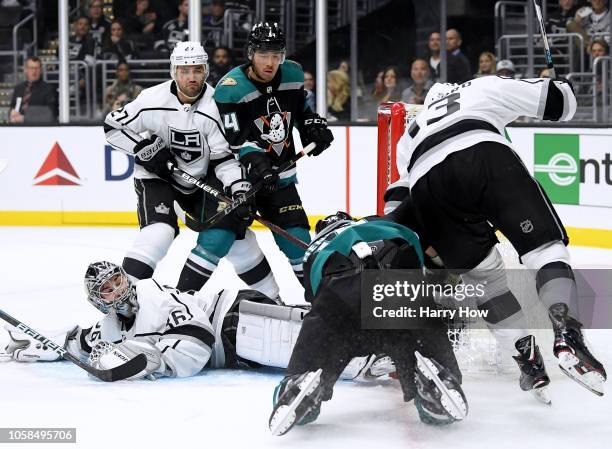 Jack Campbell of the Los Angeles Kings looks back for the puck as he makes a save on Adam Henrique of the Anaheim Ducks, as Kyle Clifford, Alec...