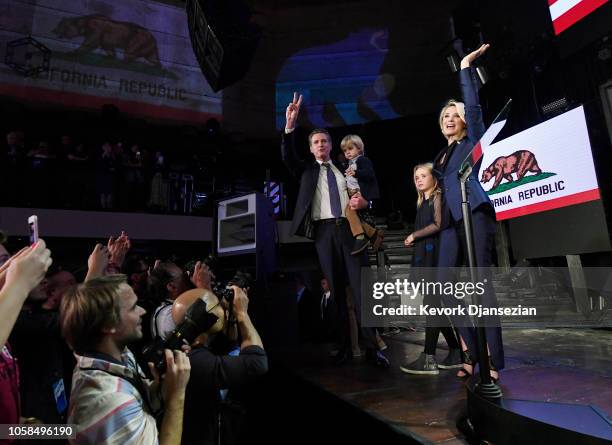 Democratic gubernatorial candidate Gavin Newsom holding his son Dutch and standing with his wife Jennifer Siebel Newsom and daughter Montana as he...