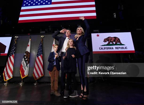 Democratic gubernatorial candidate Gavin Newsom holding his son Dutch and standing with his son Hunter wife Jennifer Siebel Newsom and daughter...