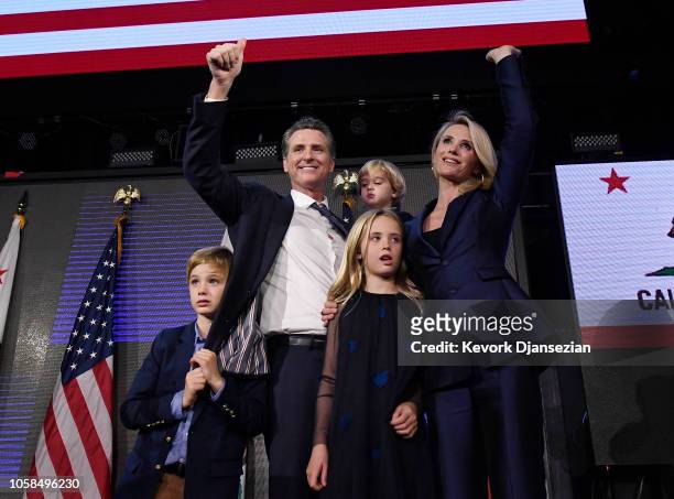 Democratic gubernatorial candidate Gavin Newsom holding his son Dutch and standing with his son Hunter wife Jennifer Siebel Newsom and daughter...