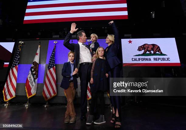 Democratic gubernatorial candidate Gavin Newsom holding his son Dutch and standing with son Hunter wife Jennifer Siebel Newsom, and daughter Montana...
