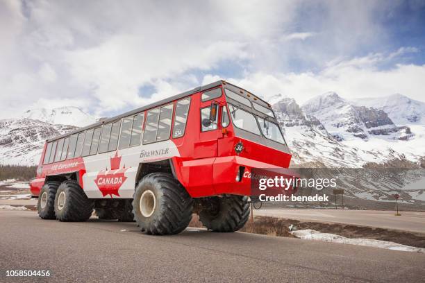 ice explorer snow coach at athabasca glacier canadian rockies - columbia icefield stock pictures, royalty-free photos & images