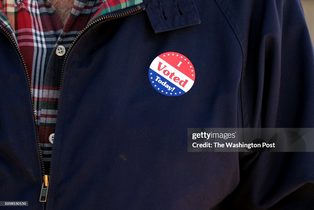 KIRKWOOD, MO - NOVEMBER 6: A voter wears a sticker outside Kirk