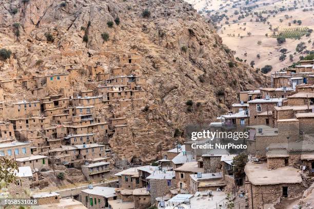 Kurdish traditional village built from mud bricks on a mountain slopes, Palangan, Kurdistan Province, Iran in September 22, 2018.