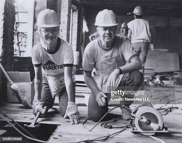 Rosalynn and Jimmy Carter at work renovating a tenement on the East 6th Street in the East Village in Manhattan on September 4, 1984. The couple were...