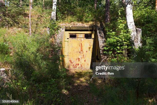 entrance into a bunker in abandoned barracks - bunker stock pictures, royalty-free photos & images