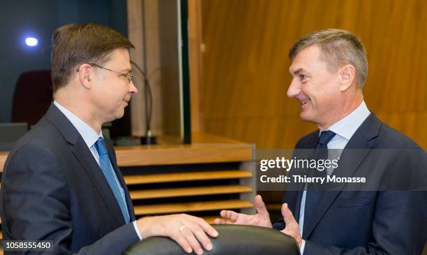 Euro & Social Dialogue Commissioner Valdis Dombrovskis is talking with the EU Digital Single Market Commissioner Andrus Ansip prior to the weekly...