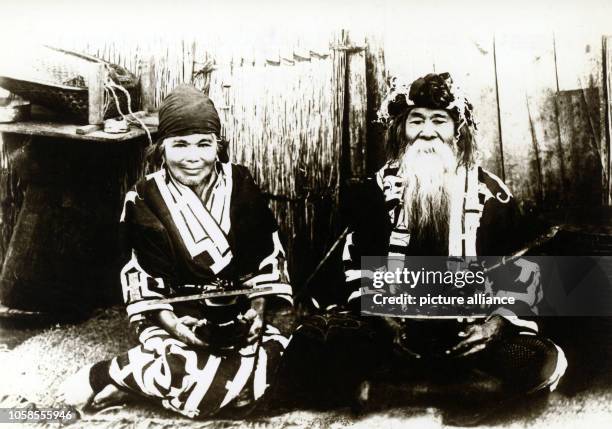 Ainu couple on the island of Hokkaido. Pictured in the early 1920th.