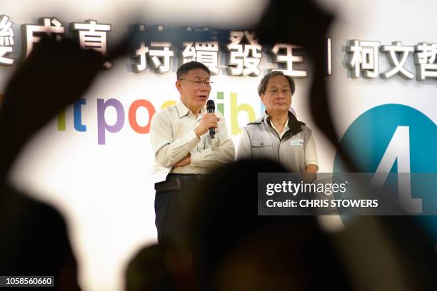 Taipei Mayor Ko Wen-je , who is seeking re-election, speaks to his grassroots supporters during a campaign event in Taipei on November 7, 2018. - Ko,...