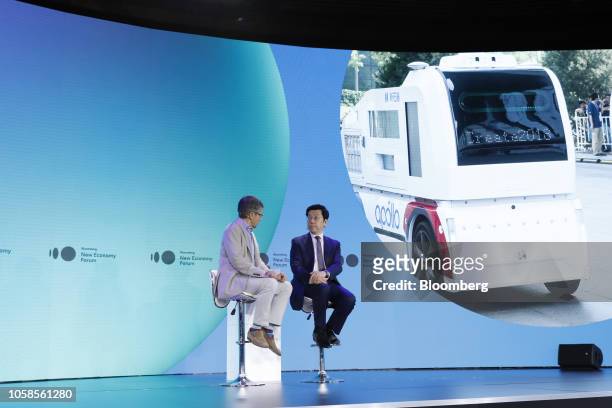 Kai-Fu Lee, chairman and chief executive officer of Sinovation Ventures, right, speaks with Ian Bremmer, president of Eurasia Group Ltd., at the...