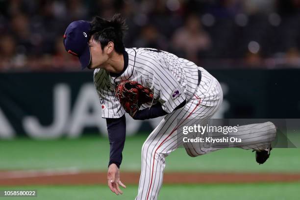 Pitcher Yu Satoh of Japan delivers a pitch in the top of 7th inning during the baseball friendly between Japan and Chinese Taipei at Fukuoka Yahuoku!...