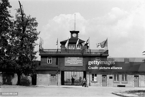 Sign reading "International Solidarity - A decisive force in the combat to secure the peace" hangs above the entrance at Buchenwald concentration...