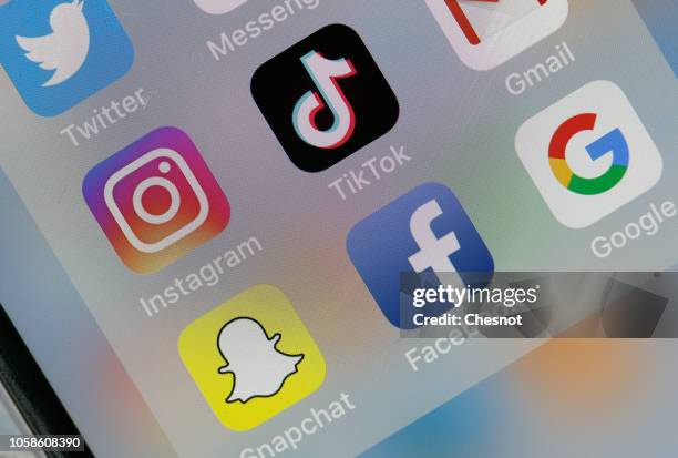 In this photo illustration, the social medias applications logos, Twitter, Instagram, Tik Tok, Snapchat, Facebook and Google are displayed on the...