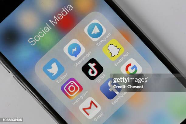 In this photo illustration, the social medias applications logos, Twitter, Messenger, Telegram, Instagram, Tik Tok, Snapchat, Gmail, Facebook and...