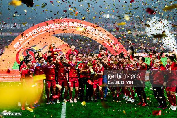 Shanghai SIPG celebrate after winning the Chinese Super League championship against Beijing Renhe during the 2018 Chinese Super League match at...