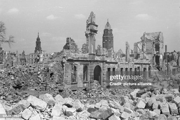 Christianstraße with rubble and ruins in Dresden. The Dresden Kreuzkirche and the New Town Hall are located in the background of the photo that was...