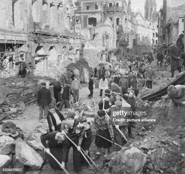 First attempts to clear the bombed Schlossstraße of Dresden and remove ruins. The photo was taken in 1945. Especially the Allied air raids between 13...