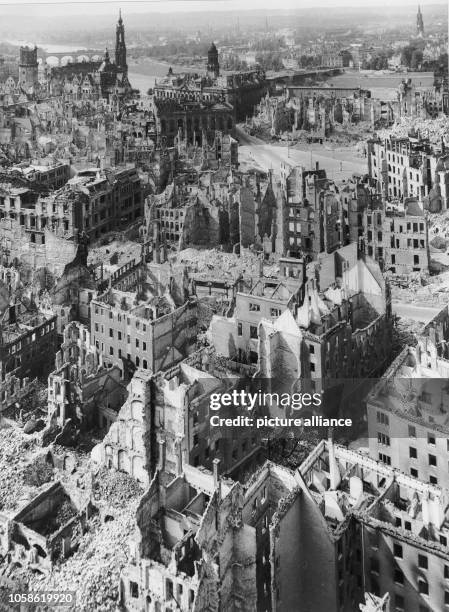 The photo by famous photographer Richard Peter sen. Shows the view from the Town Hall tower overlooking the destroyed city of Dresden towards the...