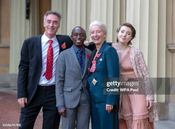 Actress Emma Thompson, with her husband Greg Wise and children Gaia Wise and Tindy Agaba, leaves Buckingham Palace after she received her damehood at...