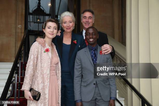Actress Emma Thompson with her husband Greg Wise and children Gaia Wise and Tindy Agaba arrive at Buckingham Palace, London, where she will receive...