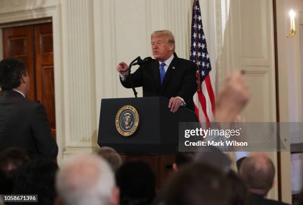 President Donald Trump gets into an exchange with Jim Acosta of CNN after giving remarks a day after the midterm elections on November 7, 2018 in the...