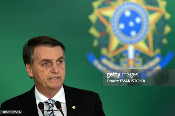 Brazilian president-elect Jair Bolsonaro delivers a joint press conference with Brazilian President Michel Temer after a meeting in Brasilia on...