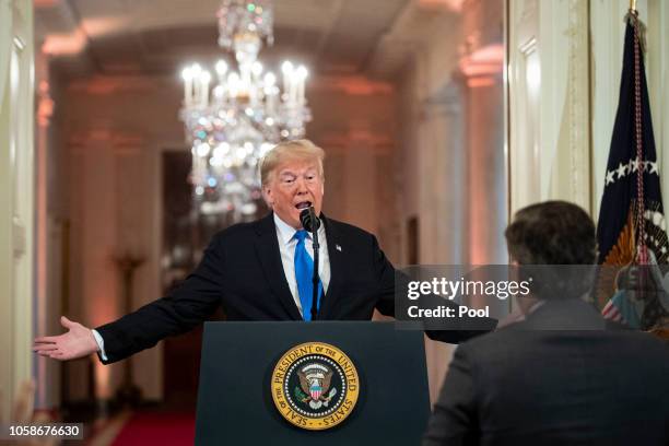 President Donald Trump gets into an exchange with CNN reporter Jim Acosta during a news conference a day after the midterm elections on November 7,...