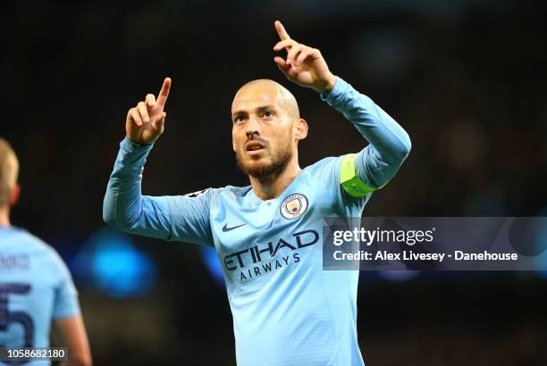David Silva of Manchester City celebrates after scoring the opening goal during the UEFA Champions League Group F match between Manchester City and...